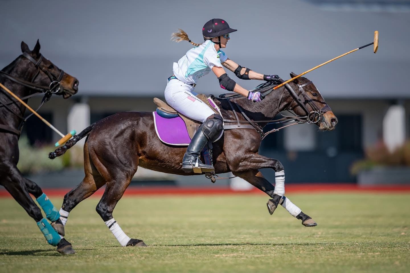 Polo player riding during a match
